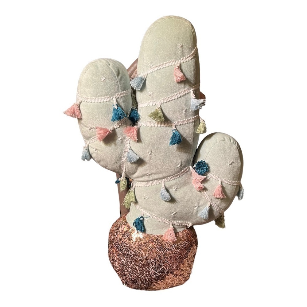 Cactus pillow with sequin trunk and fringe spikes.